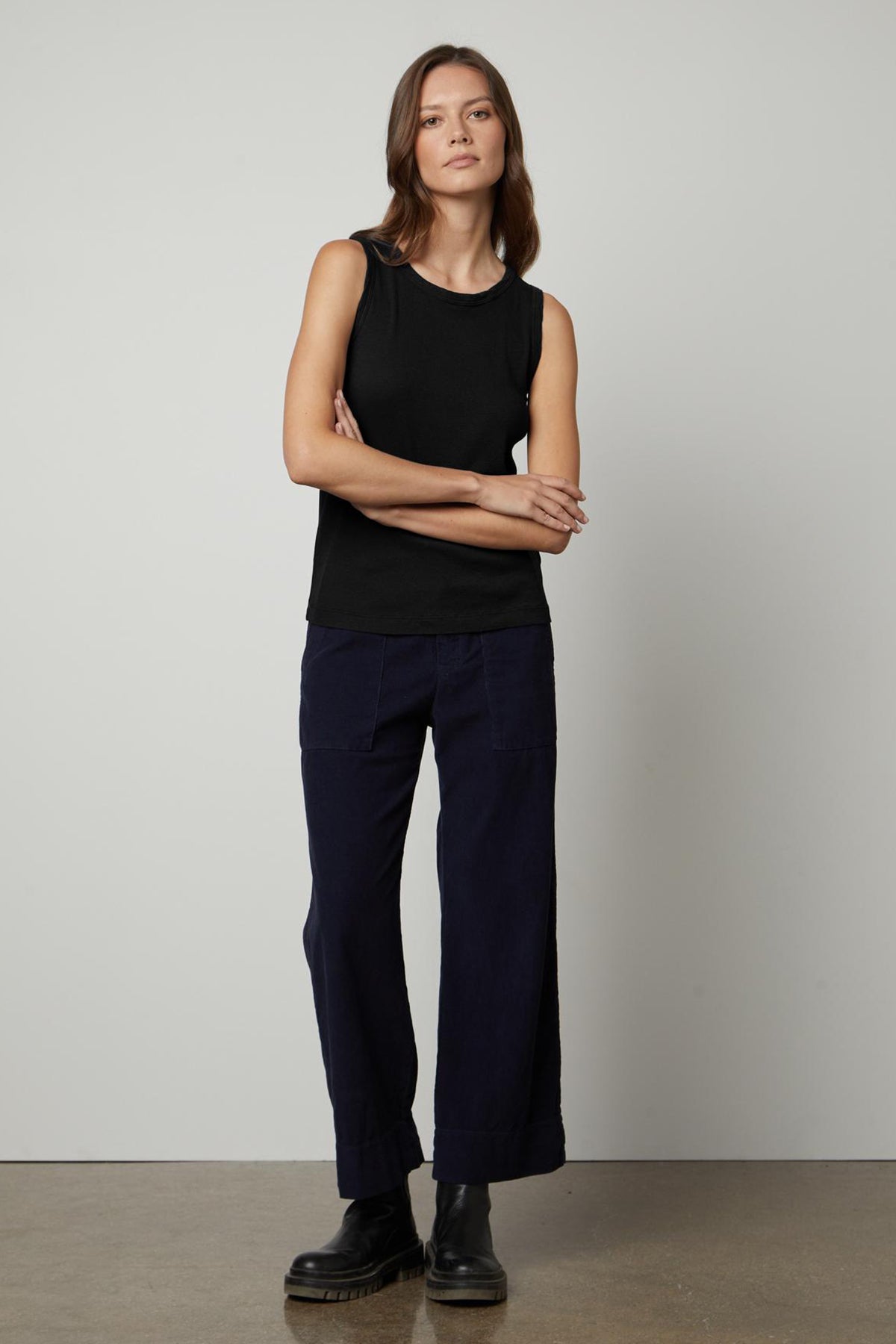 The model is wearing a black tank top and Velvet by Graham & Spencer's VERA CORDUROY WIDE LEG PANT.-26736250618049