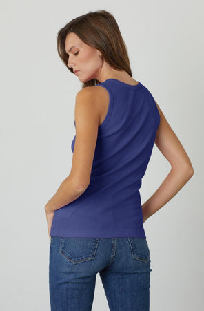 the back view of a woman wearing Velvet by Graham & Spencer's MAXIE RIBBED TANK TOP and jeans.