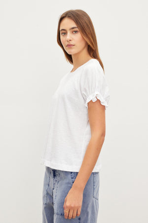 A woman in a white shirt, MIMI CREW NECK TEE by Velvet by Graham & Spencer, crew neckline.