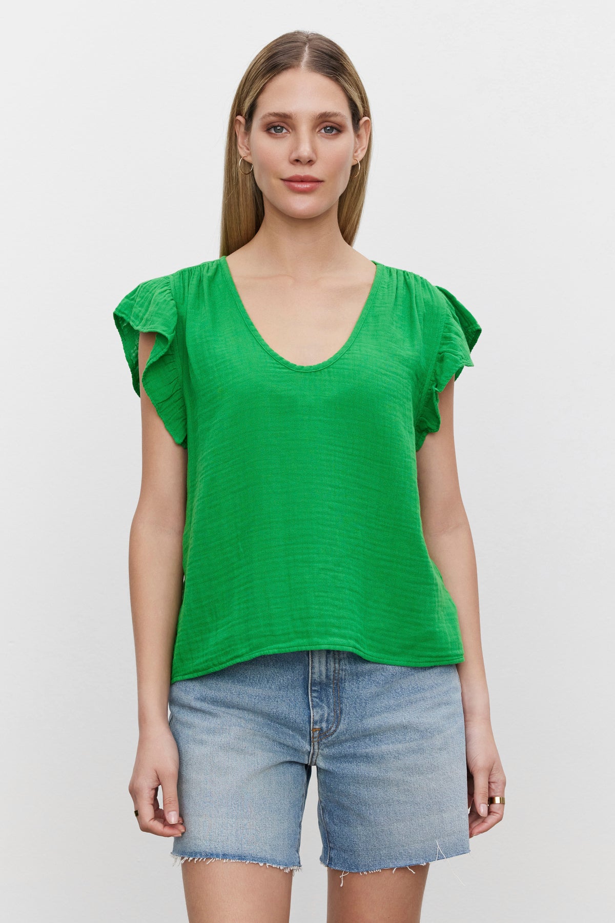   The model is wearing a REMI RUFFLE SLEEVE TOP from Velvet by Graham & Spencer, giving off a spring vibe. 