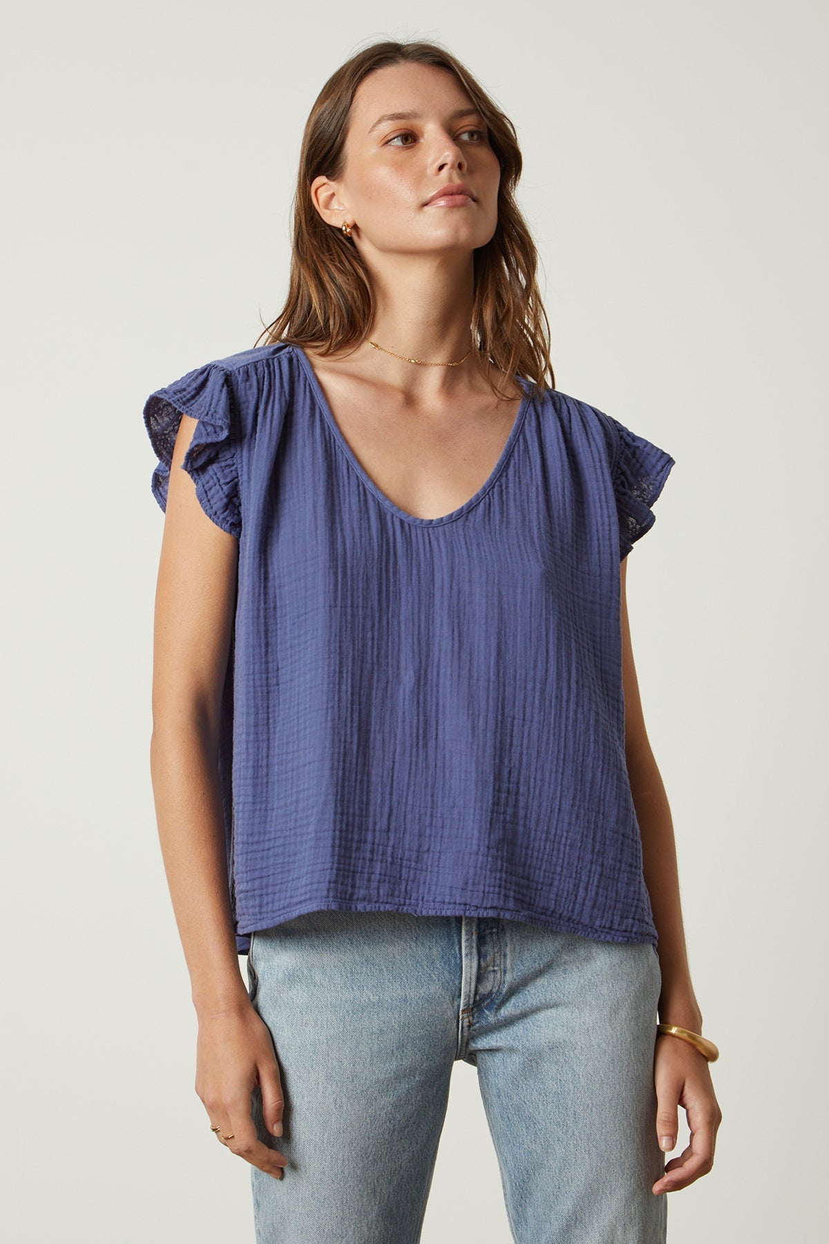 the REMI RUFFLE SLEEVE TOP in blue by Velvet by Graham & Spencer.-26631974224065