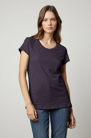 A woman wearing a ODELIA COTTON SLUB CREW NECK TEE by Velvet by Graham & Spencer and jeans.