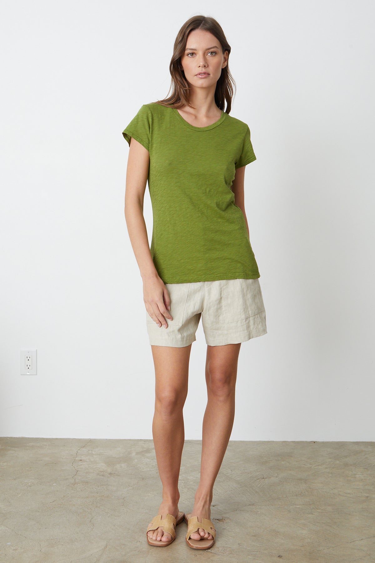 a woman wearing a Velvet by Graham & Spencer ODELIA COTTON SLUB CREW NECK TEE and shorts.-35206800638145