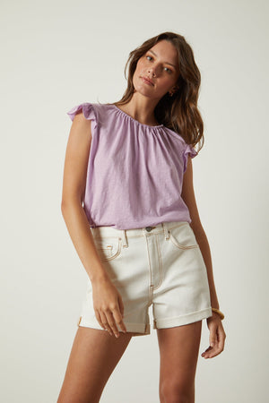 Stacy tank in lavender thistle tucked into white denim shorts front