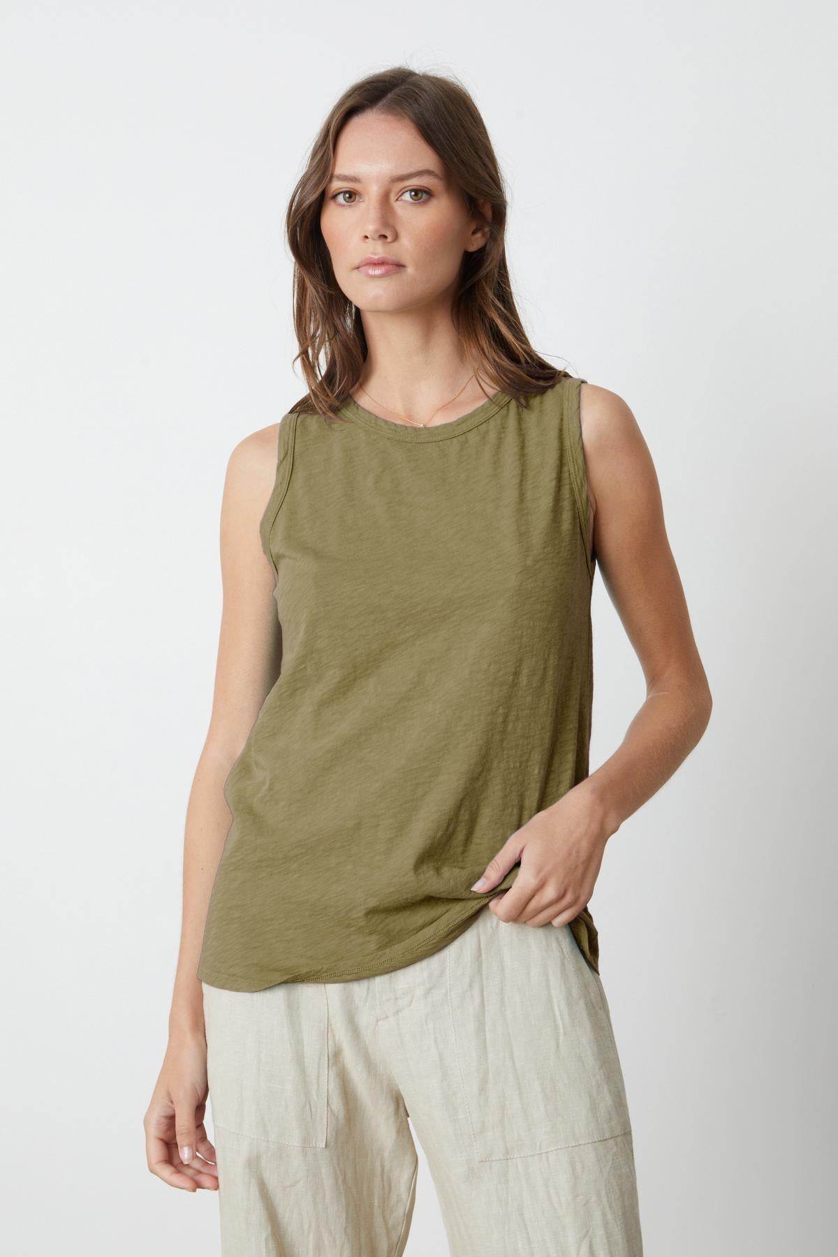   The TAURUS COTTON SLUB TANK in olive green is perfect for the tomboy-inspired look. Made of cotton slub fabric by Velvet by Graham & Spencer. 