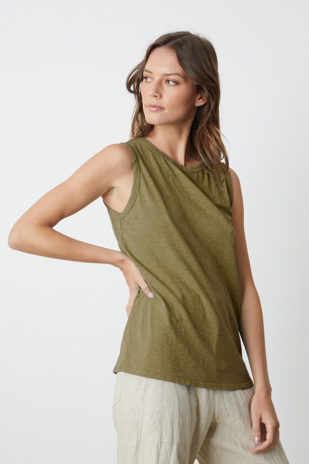   The TAURUS COTTON SLUB TANK in olive green is sleeveless and made of cotton slub, from Velvet by Graham & Spencer. 