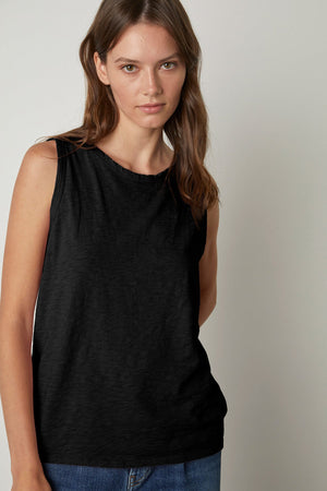 a woman wearing a Velvet by Graham & Spencer TAURUS COTTON SLUB TANK.