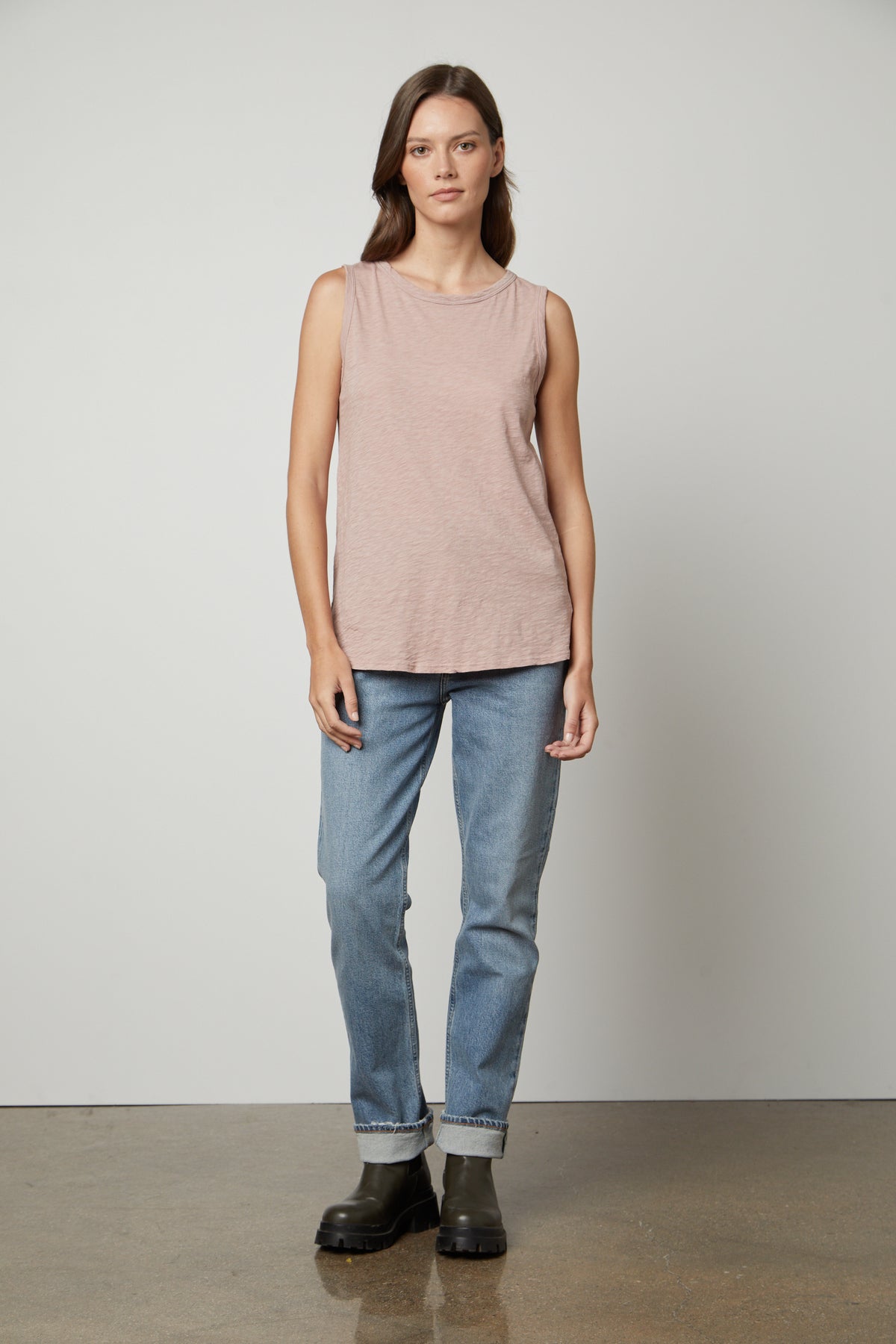   A woman wearing a Velvet by Graham & Spencer TAURUS COTTON SLUB TANK top and jeans. 