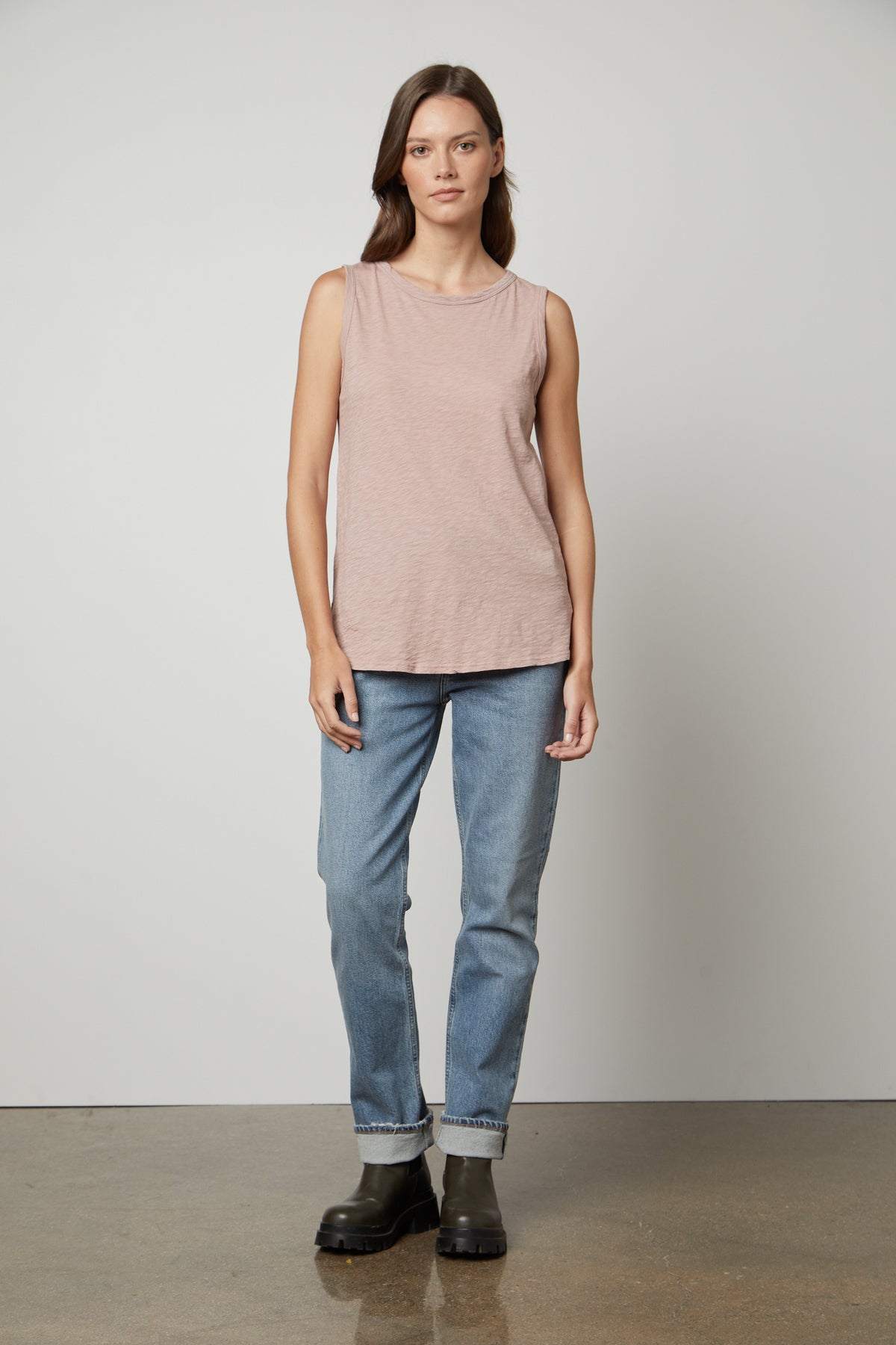 A woman wearing a Velvet by Graham & Spencer TAURUS COTTON SLUB TANK top and jeans.-35567717548225