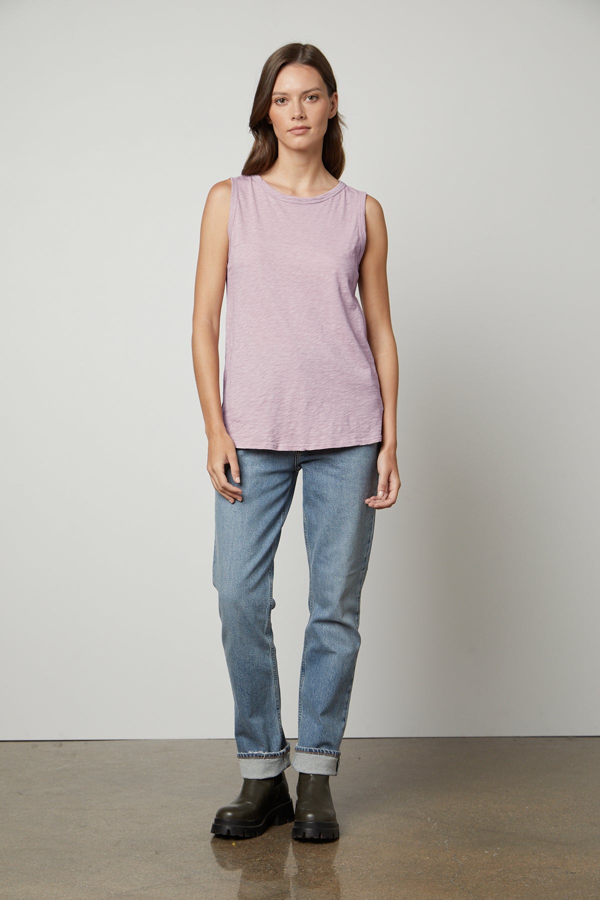   a woman wearing a Velvet by Graham & Spencer TAURUS COTTON SLUB TANK and jeans. 