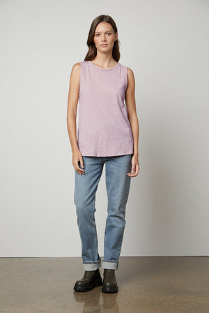 a woman wearing a Velvet by Graham & Spencer TAURUS COTTON SLUB TANK and jeans.