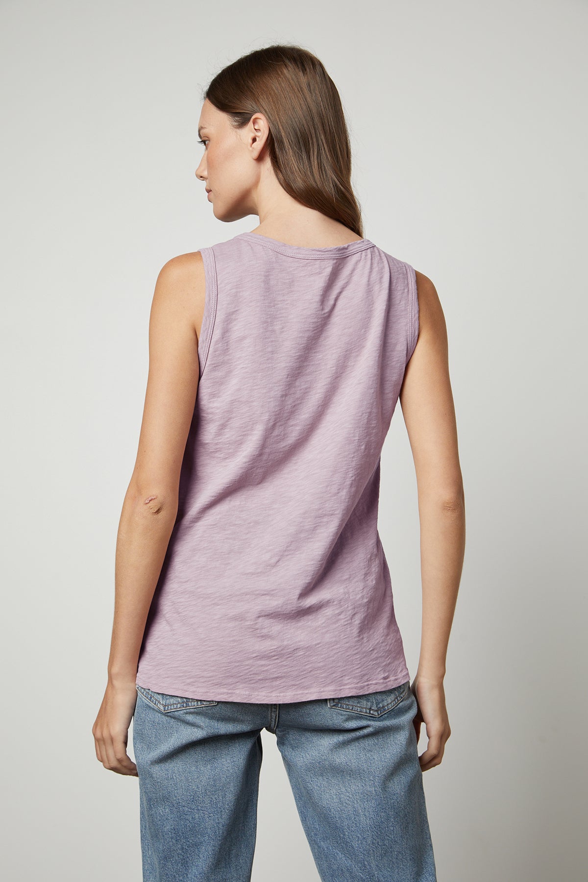 The back view of a woman wearing the Velvet by Graham & Spencer TAURUS COTTON SLUB TANK.-26632368947393