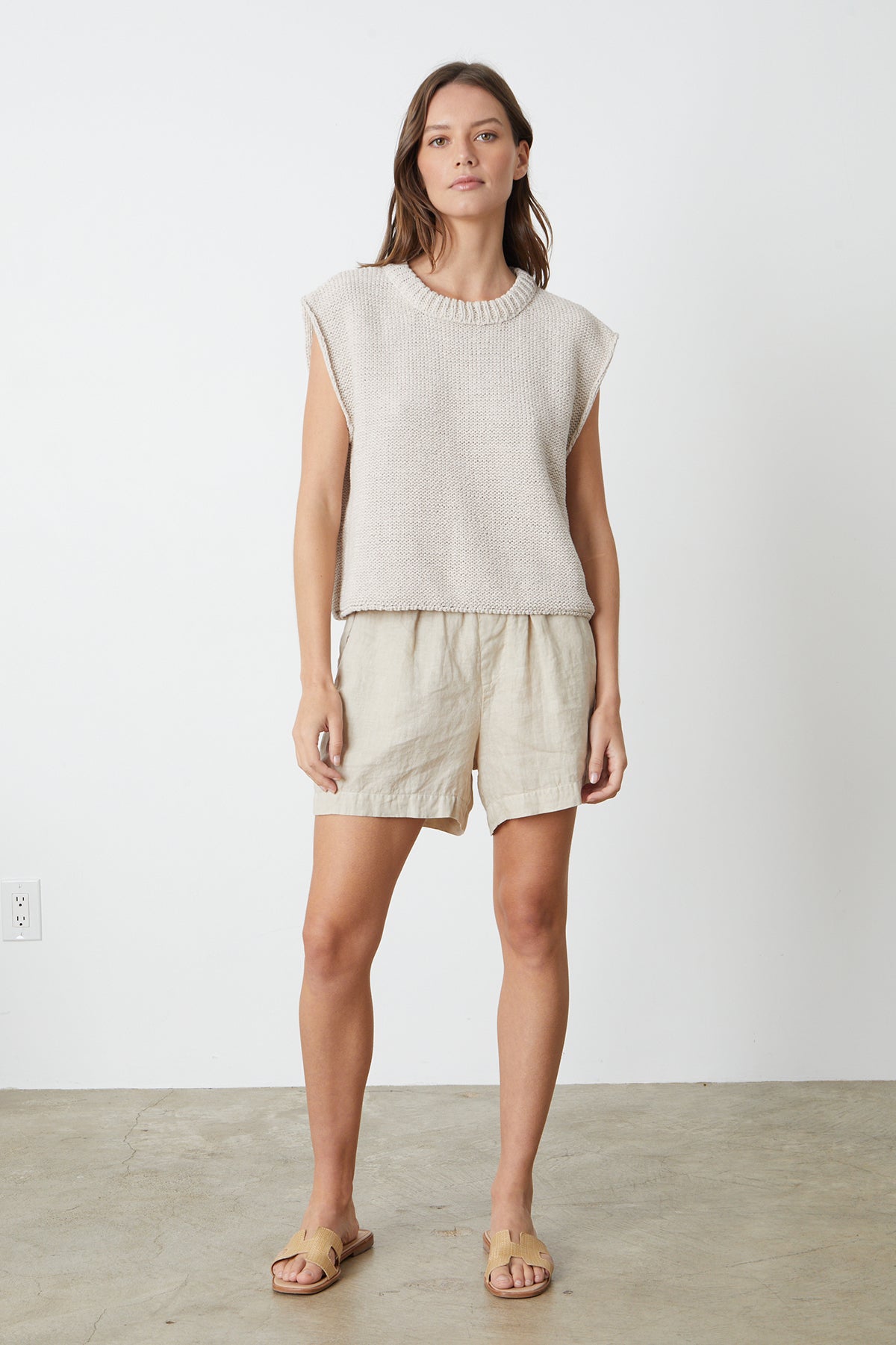 The model is wearing a Velvet by Graham & Spencer SAGE CREW NECK SWEATER and shorts.-26342770770113