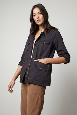 A woman wearing a Velvet by Graham & Spencer RUBY LIGHT-WEIGHT ARMY JACKET.