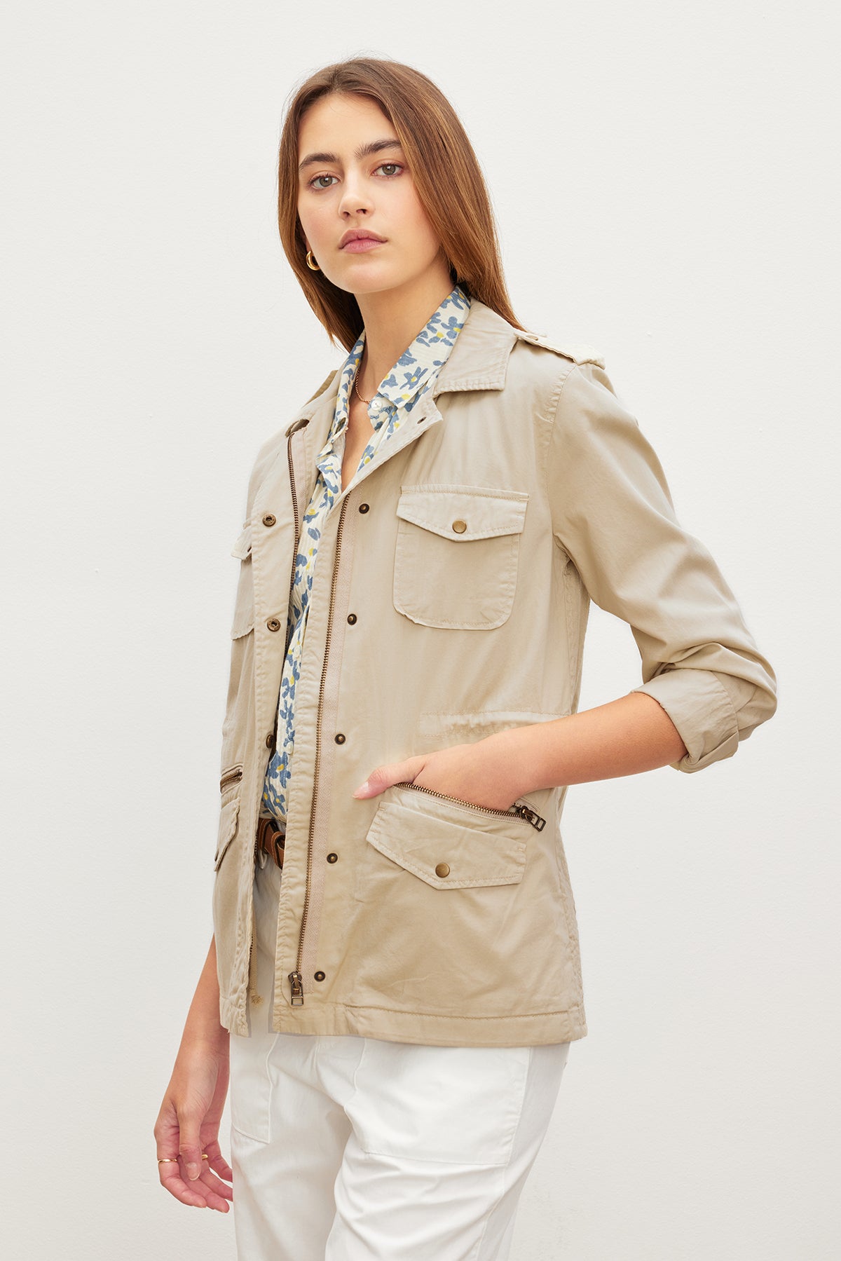   A woman wearing a Velvet by Graham & Spencer RUBY LIGHT-WEIGHT ARMY JACKET. 