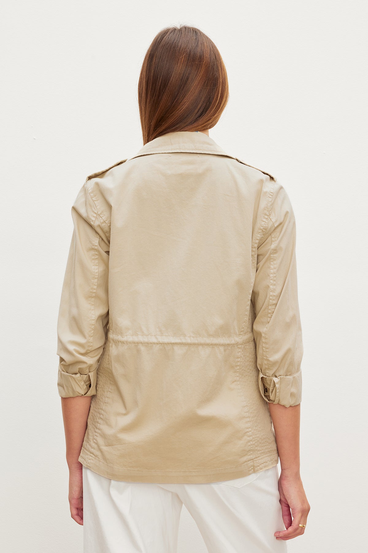 The back view of a woman wearing a RUBY LIGHT-WEIGHT ARMY JACKET made by Velvet by Graham & Spencer, showcasing its versatility.-35967534006465