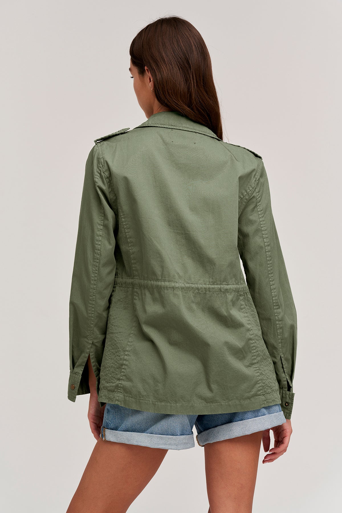 The back view of a woman wearing a RUBY LIGHT-WEIGHT ARMY JACKET by Velvet by Graham & Spencer.-35207196311745