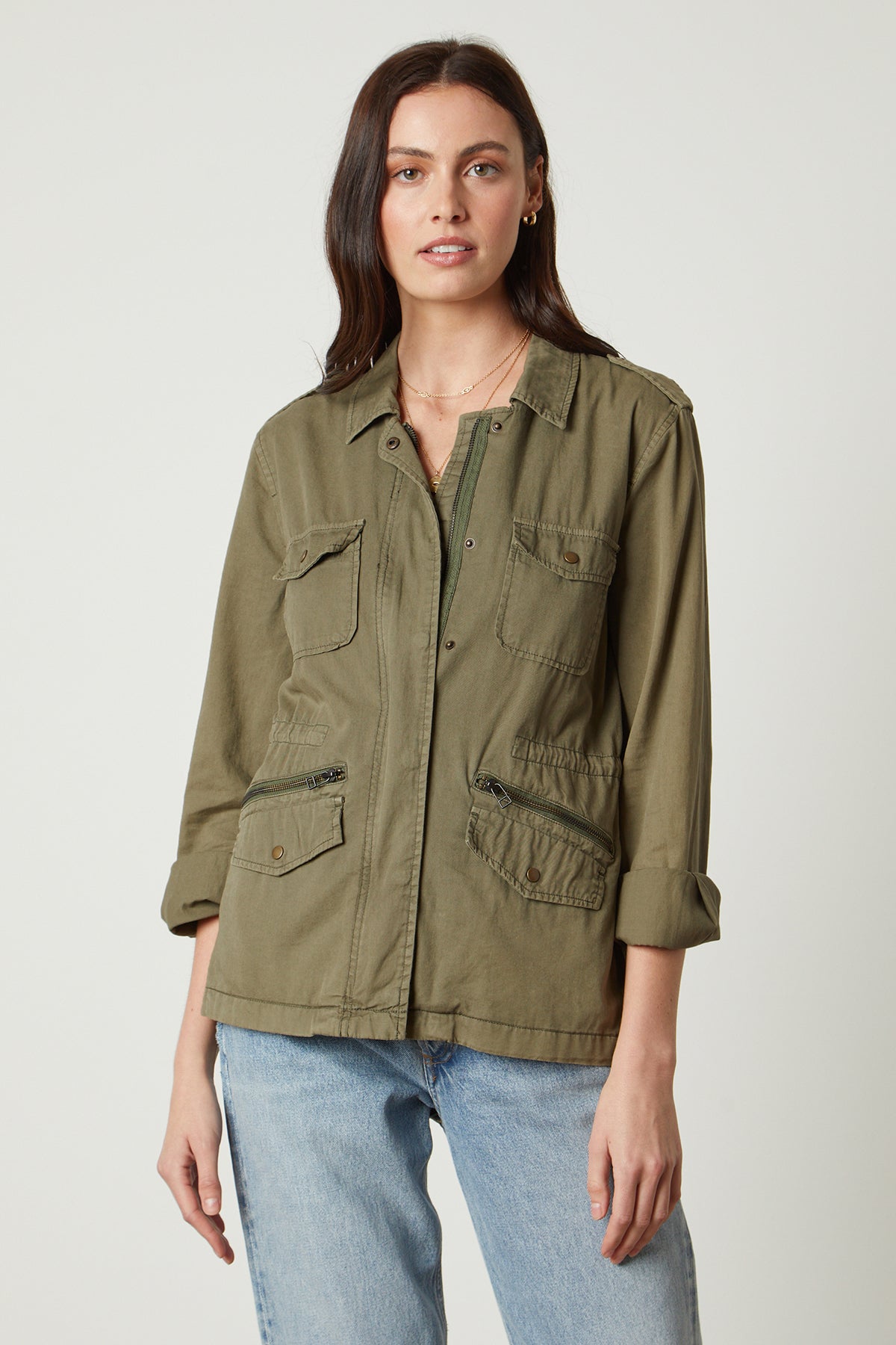   The RUBY LIGHT-WEIGHT ARMY JACKET in olive green, by Velvet by Graham & Spencer, exudes rock and roll glamour. 