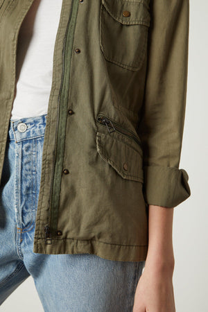 A woman wearing a RUBY LIGHT-WEIGHT ARMY JACKET, cotton twill, and jeans by Velvet by Graham & Spencer.