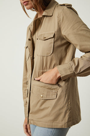 the model is wearing a Velvet by Graham & Spencer RUBY LIGHT-WEIGHT ARMY JACKET with pockets.