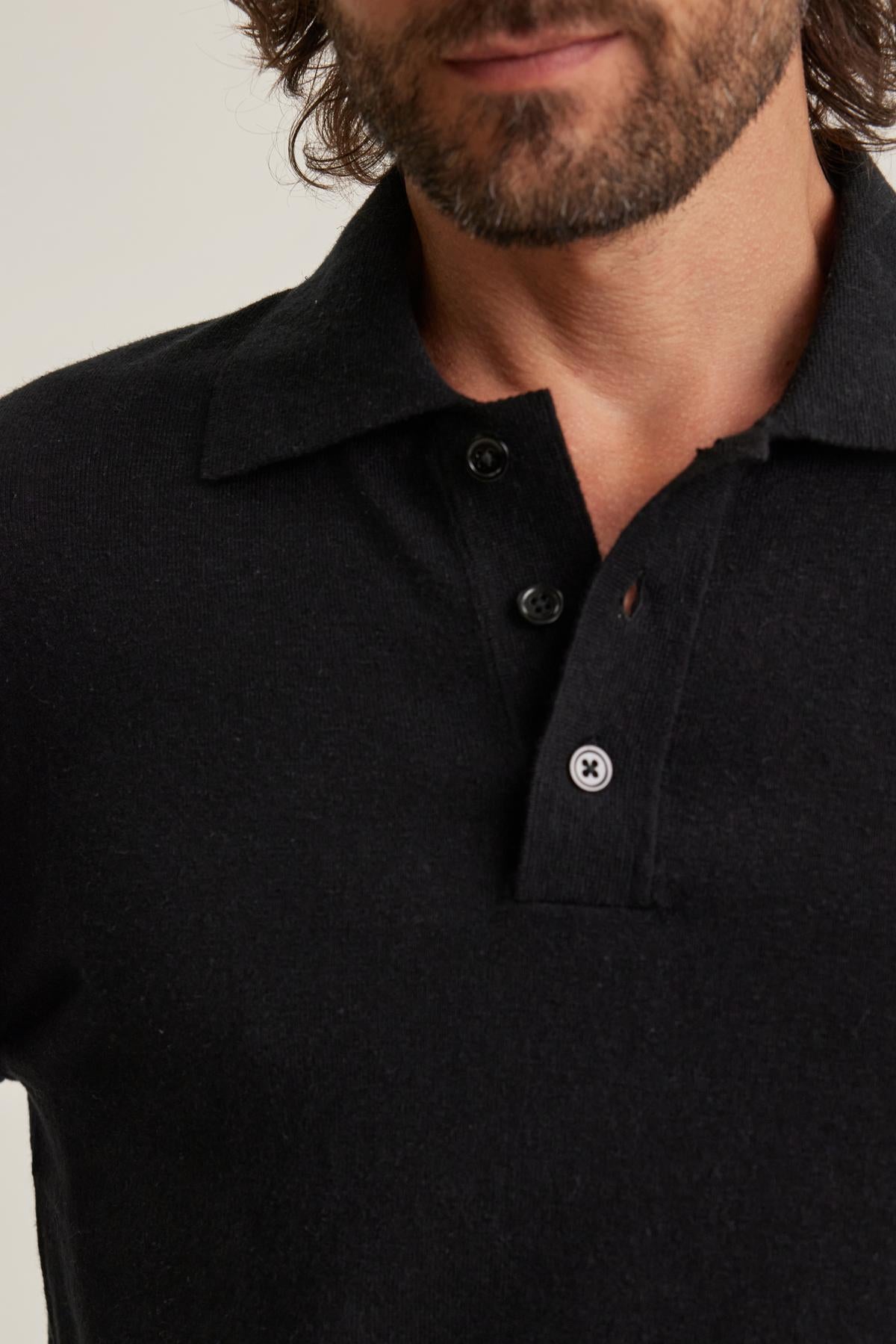   Close-up of someone wearing a Matteo Cotton Linen Polo Sweater by Velvet by Graham & Spencer. 