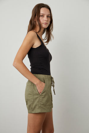 The model is wearing a black tank top and Velvet by Graham & Spencer's TENLEY COTTON TWILL SHORT.