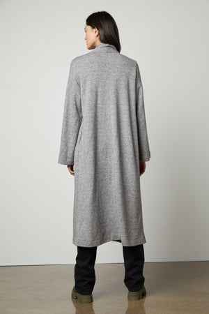 The back view of a woman wearing a Velvet by Graham & Spencer Patricia Double Knit Duster Cardigan.