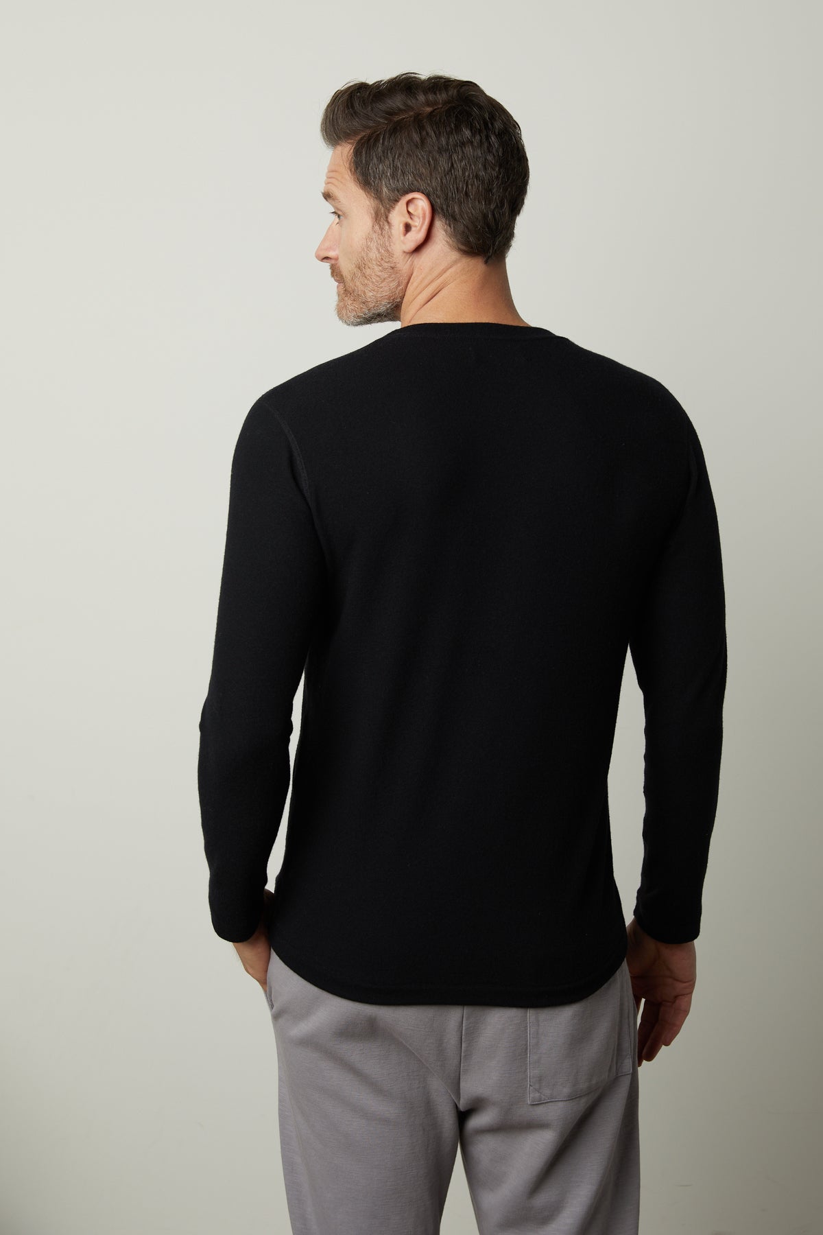   The back of a man wearing a Velvet by Graham & Spencer Cozy Jersey Crew. 