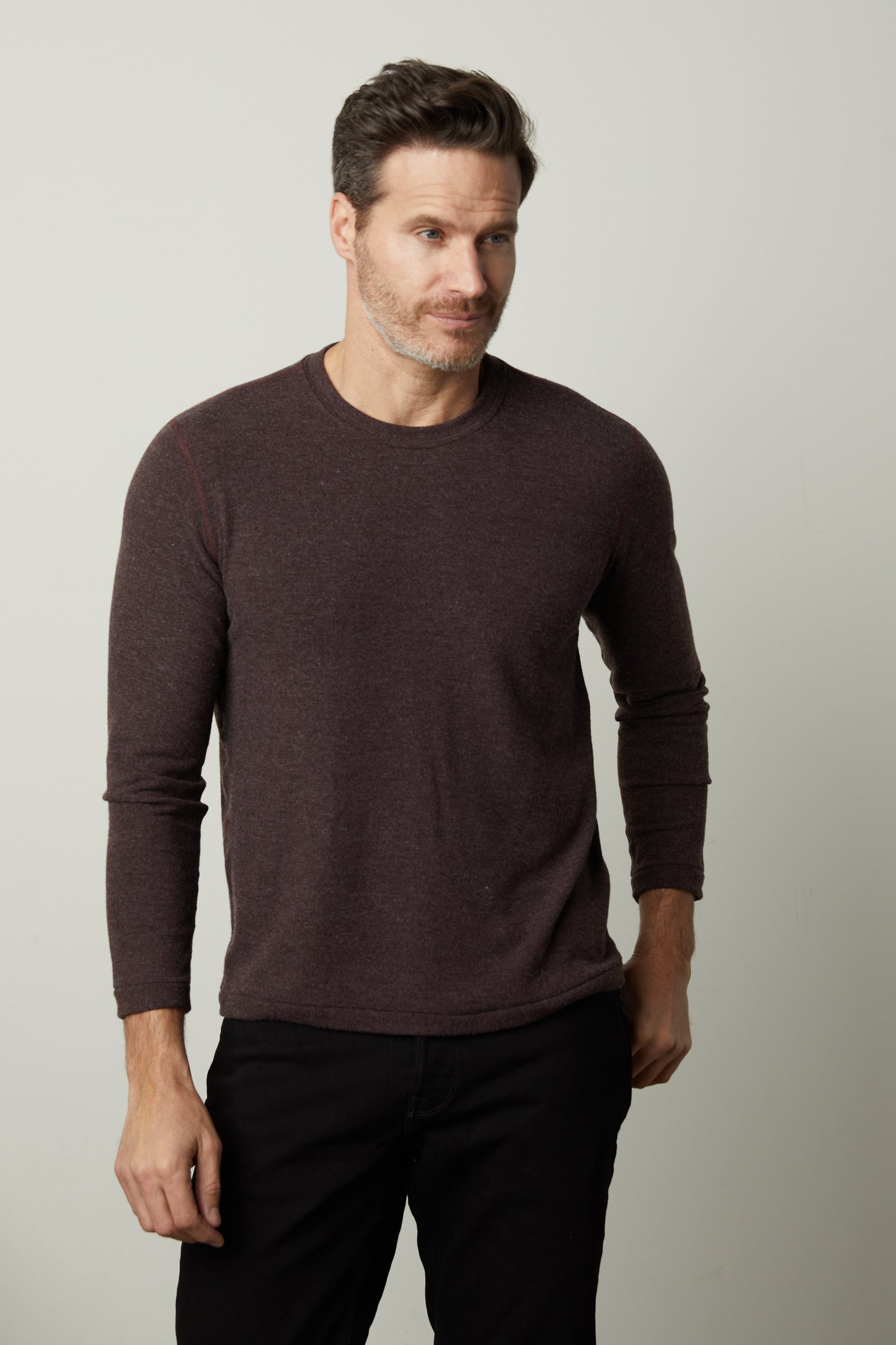 A man wearing a modern comfortable Velvet by Graham & Spencer BECKER COZY JERSEY CREW maroon sweater.-26846316167361