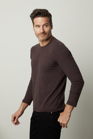 A man wearing a Velvet by Graham & Spencer BECKER COZY JERSEY CREW sweater.