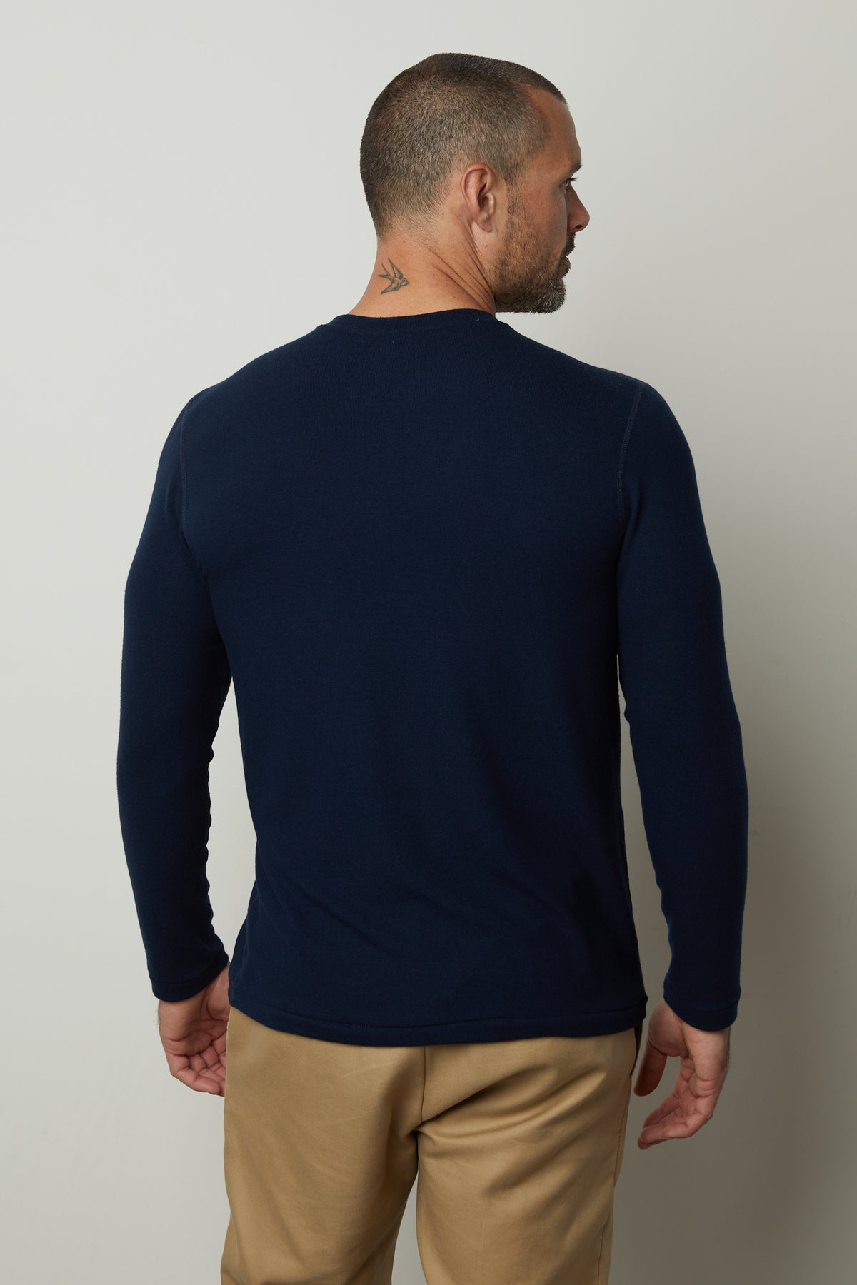   The back view of a man wearing a Velvet by Graham & Spencer BECKER COZY JERSEY CREW. 