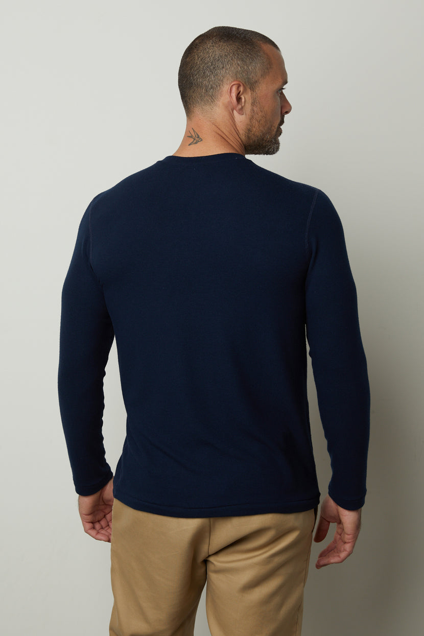 The back view of a man wearing a Velvet by Graham & Spencer BECKER COZY JERSEY CREW.