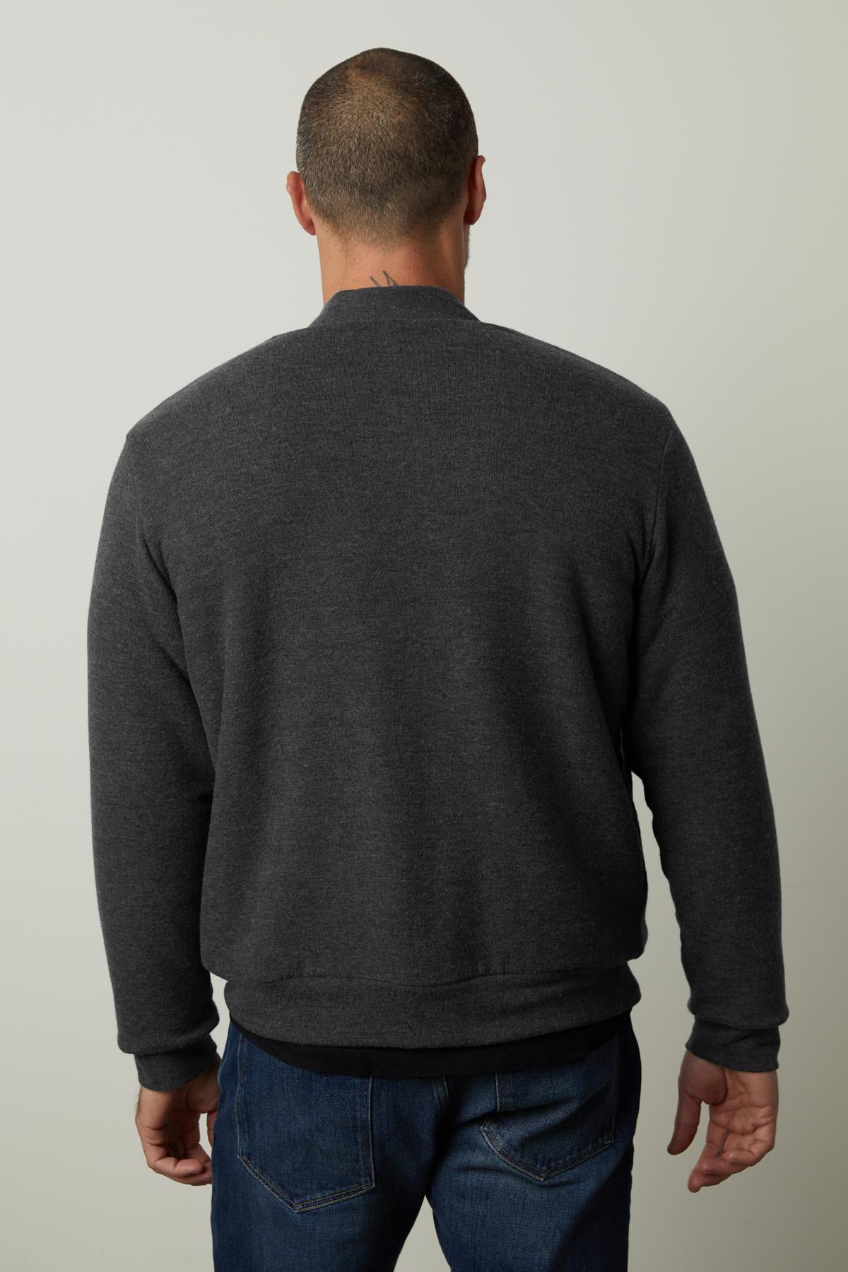   The back view of a man wearing a Velvet by Graham & Spencer MILES ZIP-UP JACKET with a cozy sherpa lining. 