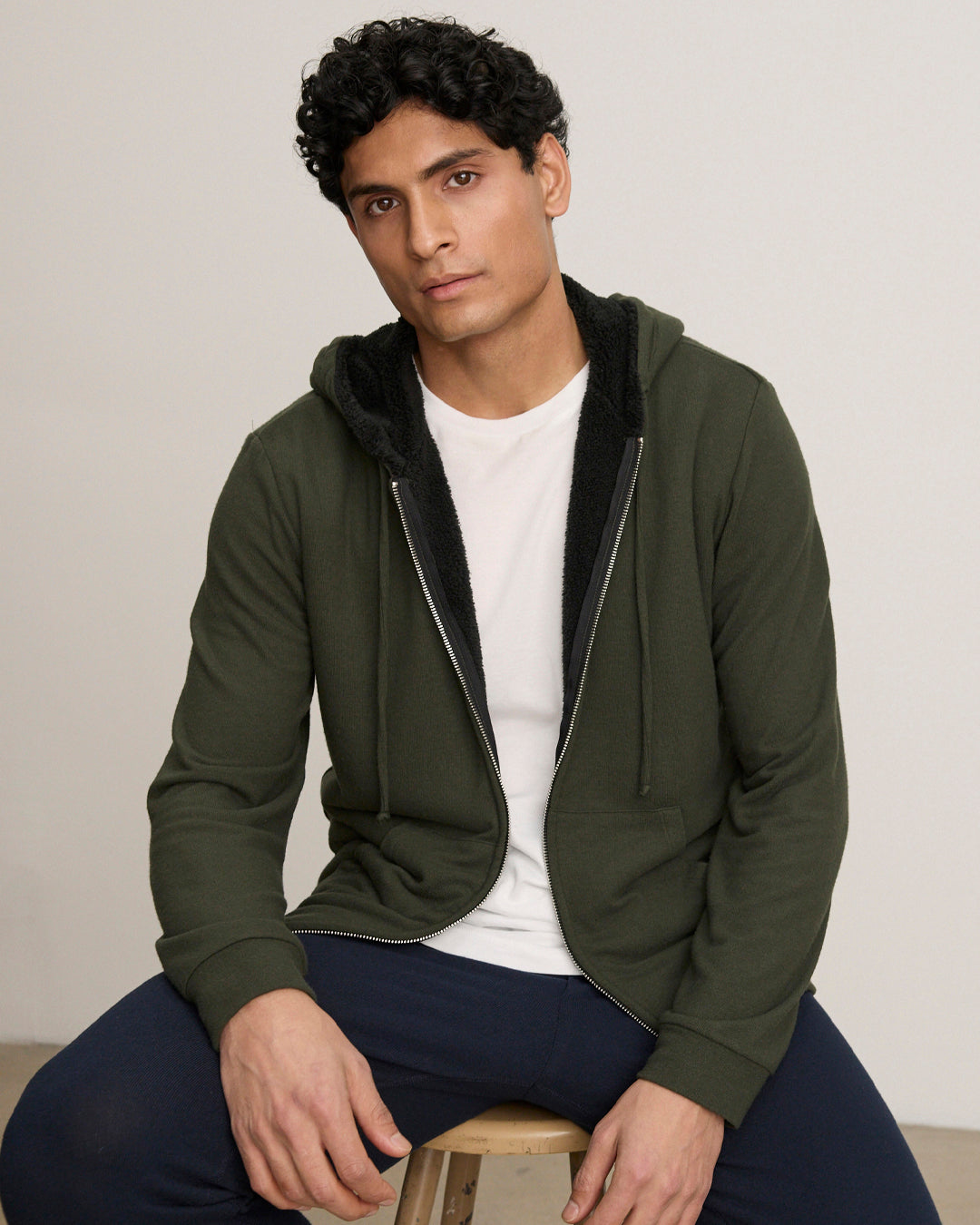 A man wearing the Salvadore Hoodie by Velvet by Graham & Spencer.