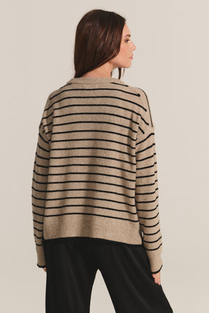 A woman in the ROMY SWEATER by Velvet by Graham & Spencer.