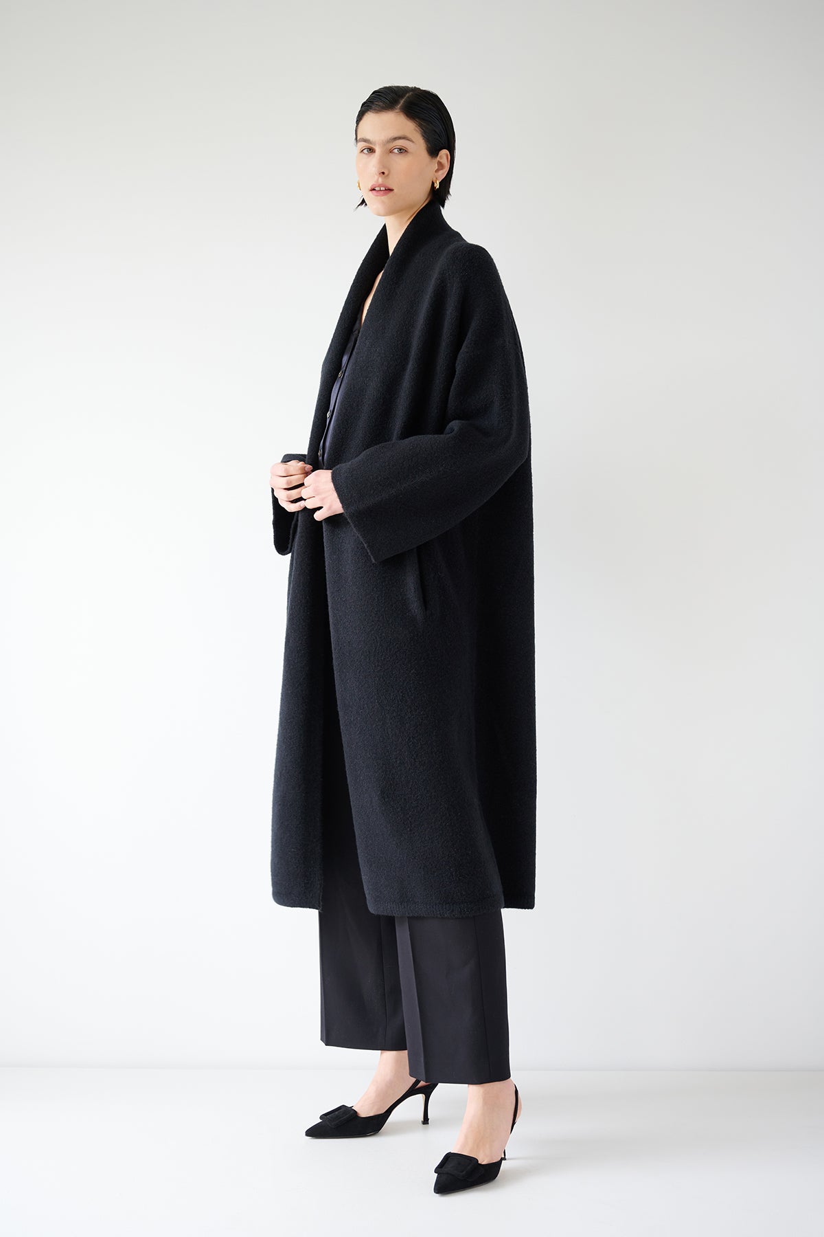A woman wearing a black Velvet by Jenny Graham CARMEL COAT.-35547930394817