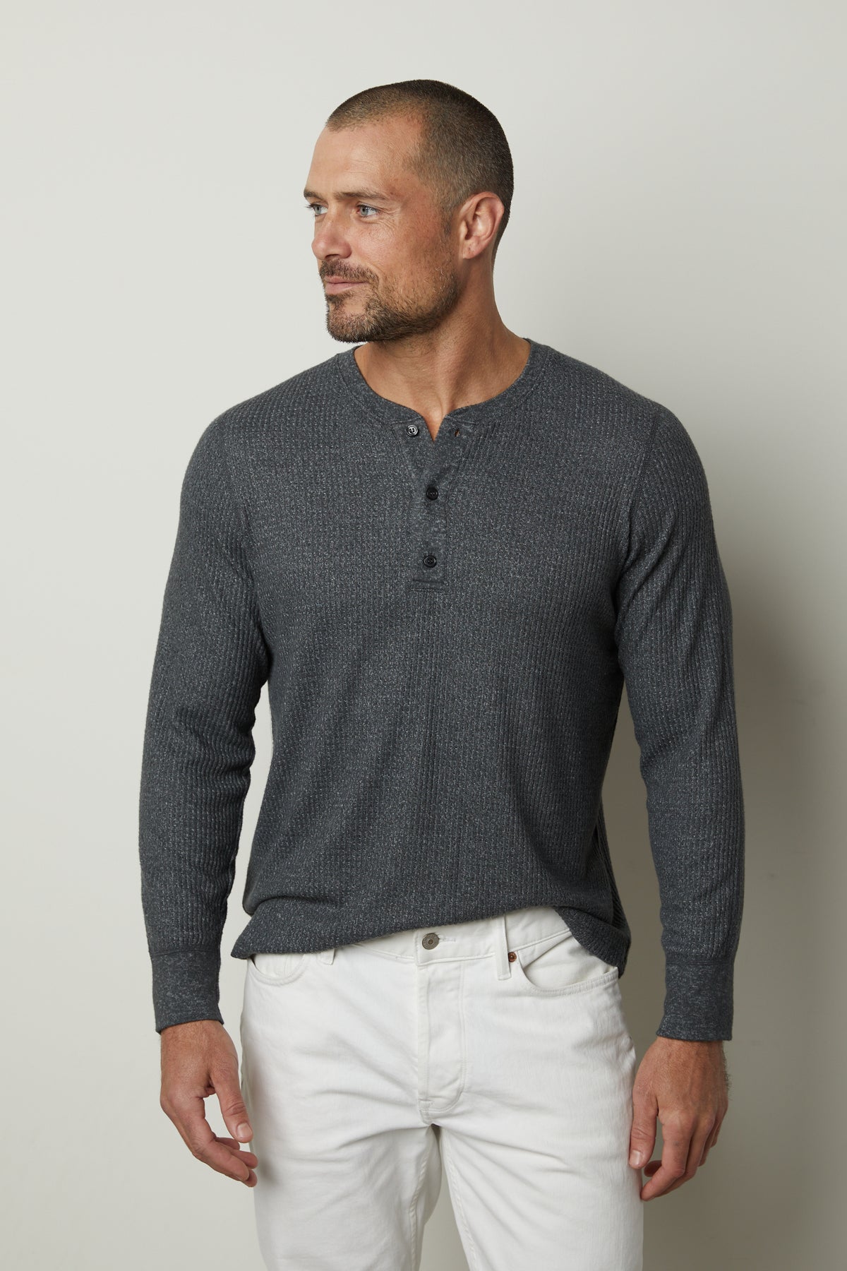 A man wearing a grey Velvet by Graham & Spencer ANTHONY THERMAL HENLEY shirt.-35547473838273