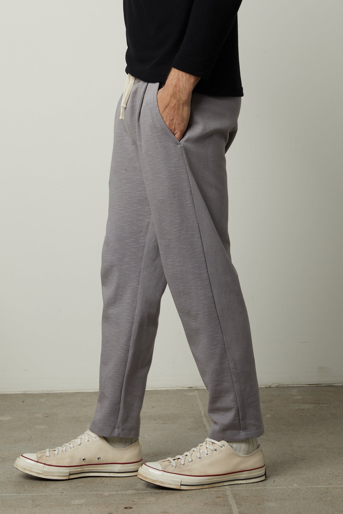 A man wearing Velvet by Graham & Spencer PARKER sweatpants and sneakers.-26846221304001