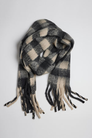 An ELLE plaid scarf from Velvet by Graham & Spencer, with fringe ends, offering warmth and comfort.