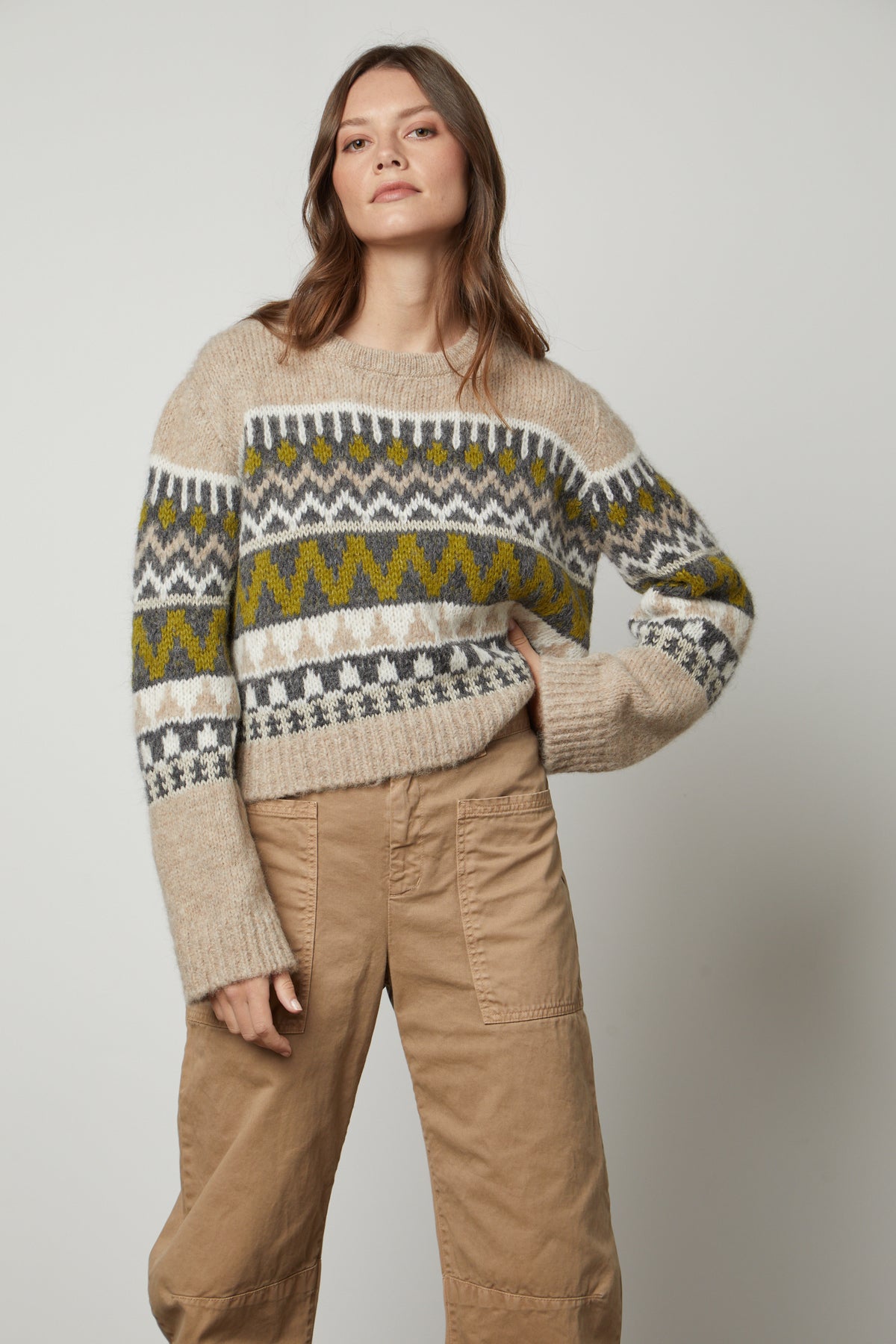   The model is wearing a cozy Velvet by Graham & Spencer MAKENZIE ALPACA CABLE KNIT CREW NECK SWEATER. 