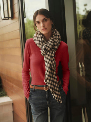 A woman wearing Velvet by Graham & Spencer whisper-soft cotton jeans and a plaid scarf.