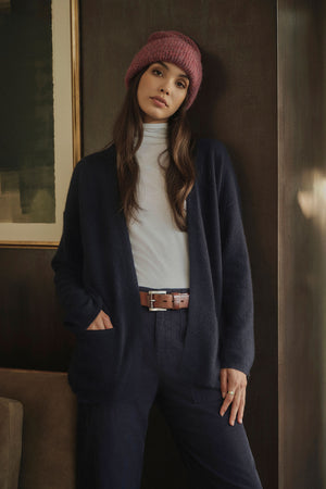 The model is wearing a Velvet by Graham & Spencer LILA cashmere cardigan.