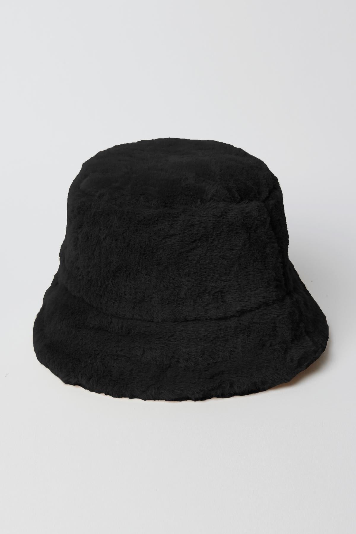   A chic Velvet by Graham & Spencer FAUX FUR BUCKET HAT on a white surface. 