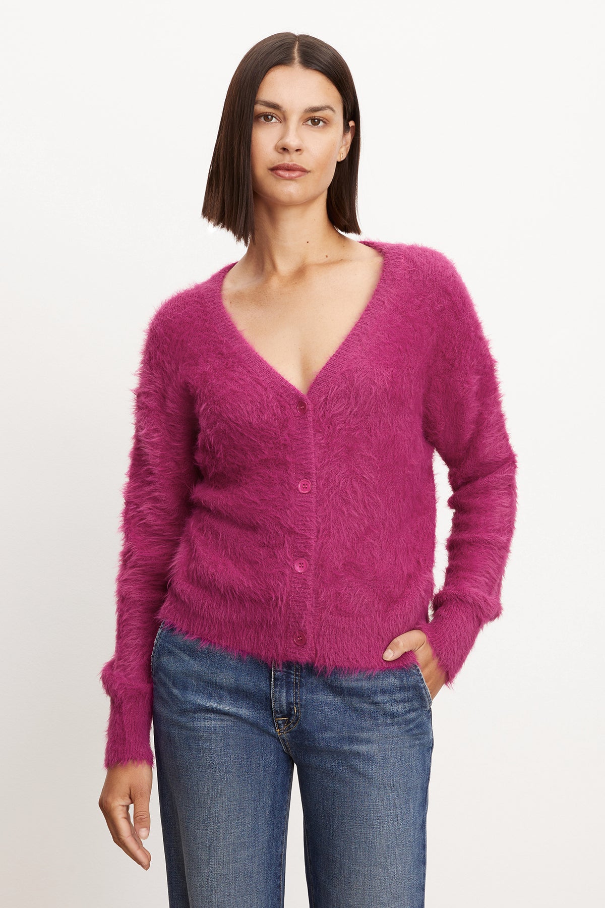 A model wearing a pink Velvet by Graham & Spencer KELSEY FEATHER YARN CARDIGAN.-35571997900993