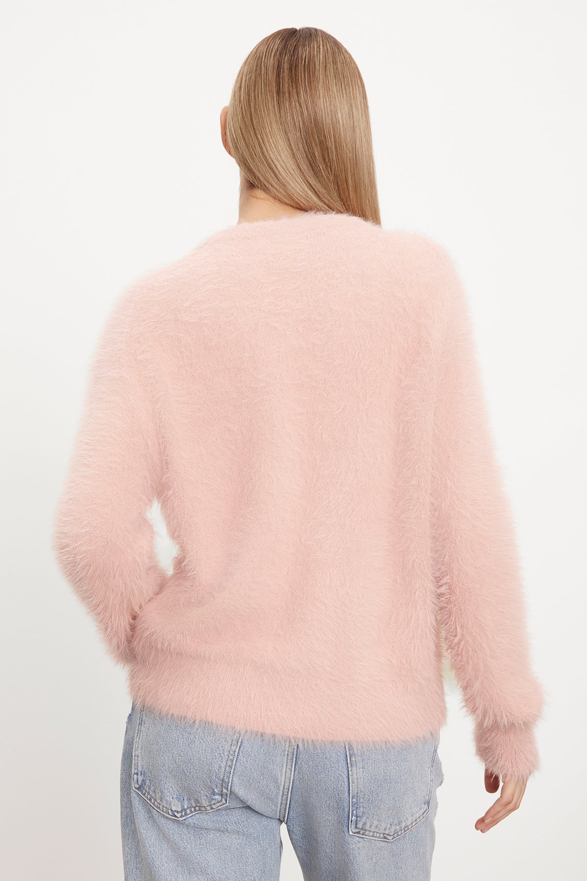   The back view of a woman wearing a Velvet by Graham & Spencer KELSEY FEATHER YARN CARDIGAN. 