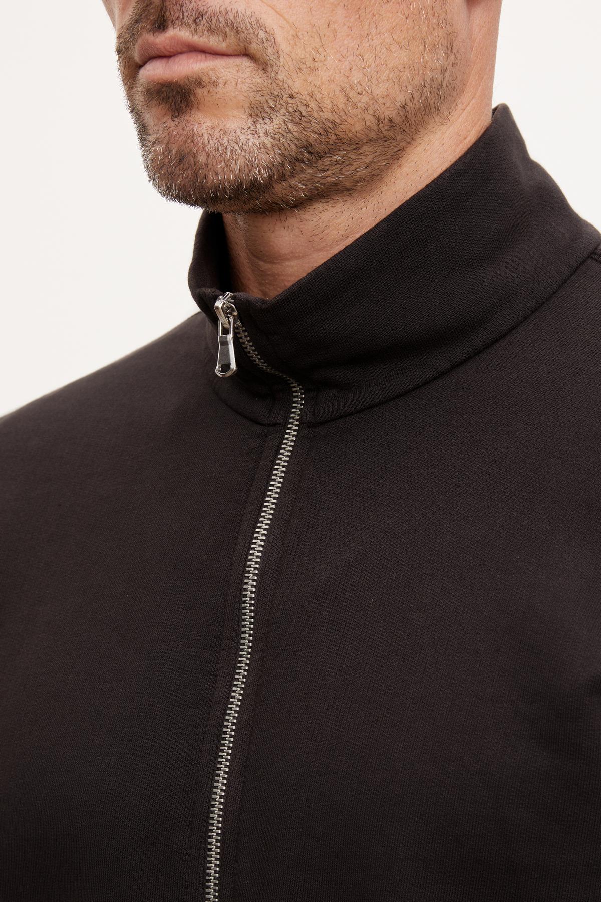 A man in a black Velvet by Graham & Spencer TERRY FRENCH TERRY FULL-ZIP jacket.-36008992833729