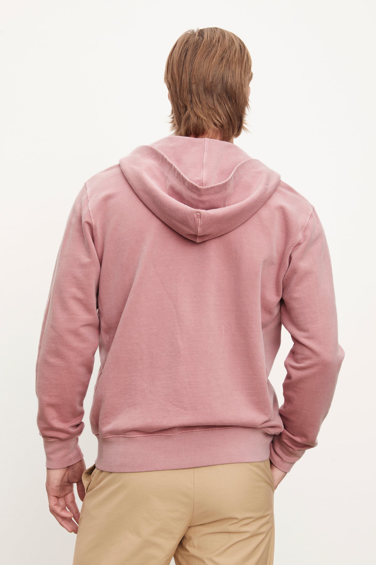 Man standing with his back to the camera, wearing a Velvet by Graham & Spencer VINCENT HOODIE and beige pants against a white background.-36732532588737