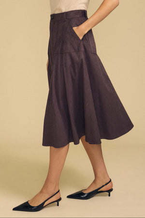 Styled for effortless transitional dressing, this look features a beige top paired with the BELINDA FAUX SUEDE SKIRT by Velvet by Graham & Spencer—a dark brown skirt with pockets—finished with black slingback heels, set against a neutral background.
