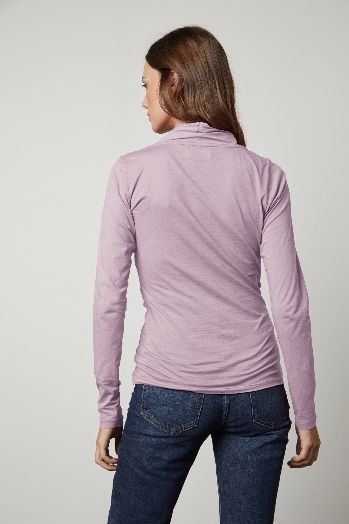 the back view of a woman wearing a Velvet by Graham & Spencer MERI WRAP FRONT FITTED TOP.-26630825509057