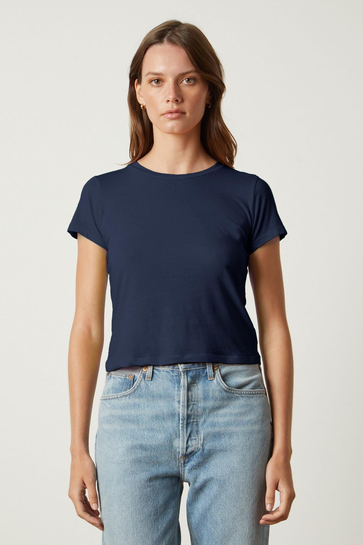   The Velvet by Graham & Spencer NINA CROPPED CREW NECK TEE in navy made of whisper cotton knit fabric. 